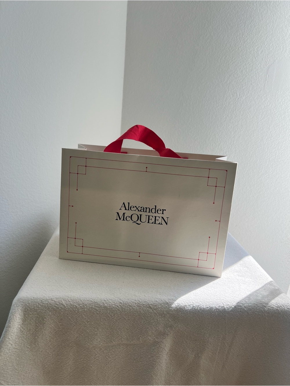 Alexander McQueen Cream Gift Bag with Red Ribbon